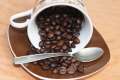 cup of spilt roasted coffee beans