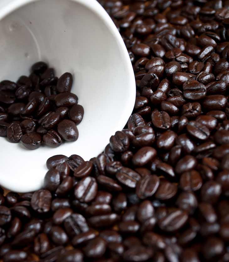 dark coffee beans in cup