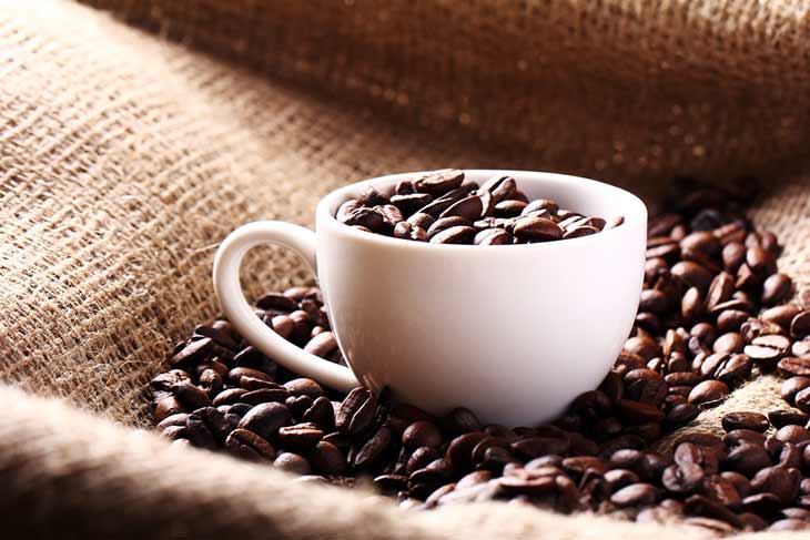 cup of roasted coffee beans
