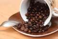 cup of spilt roasted coffee beans