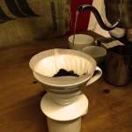 kettle pouring water into Hario v60 filter