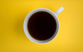 yellow-flatlay-black-coffee-cup-white-handle-mug-minimal